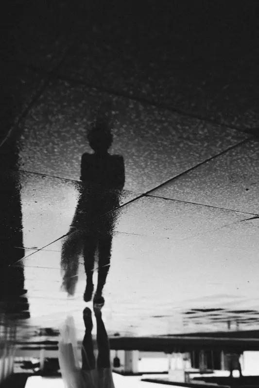 Abstract reflection of a figure, representing the distorted reality of anticipatory grief