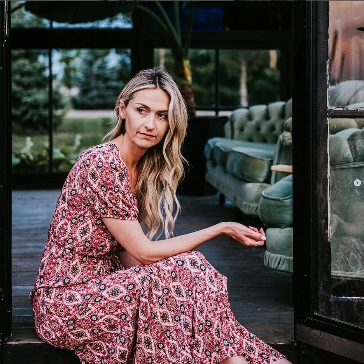 Reflective portrait of Leanne Sawchuk, grief therapist in Kitchener, seated thoughtfully.